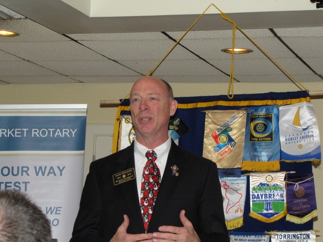 Alex Wilkins, Governor for Rotary District 7570, speaks to New Market Rotary with a focus on being passionate about our membership and service in our Club.
