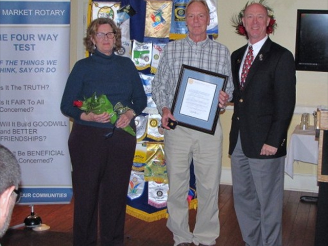 Kevin and Judy Cannon with Alex Wilkins, District Governor, who presented the Governor's Appreciation Award to Kevin for all his work with the Rotary Club.